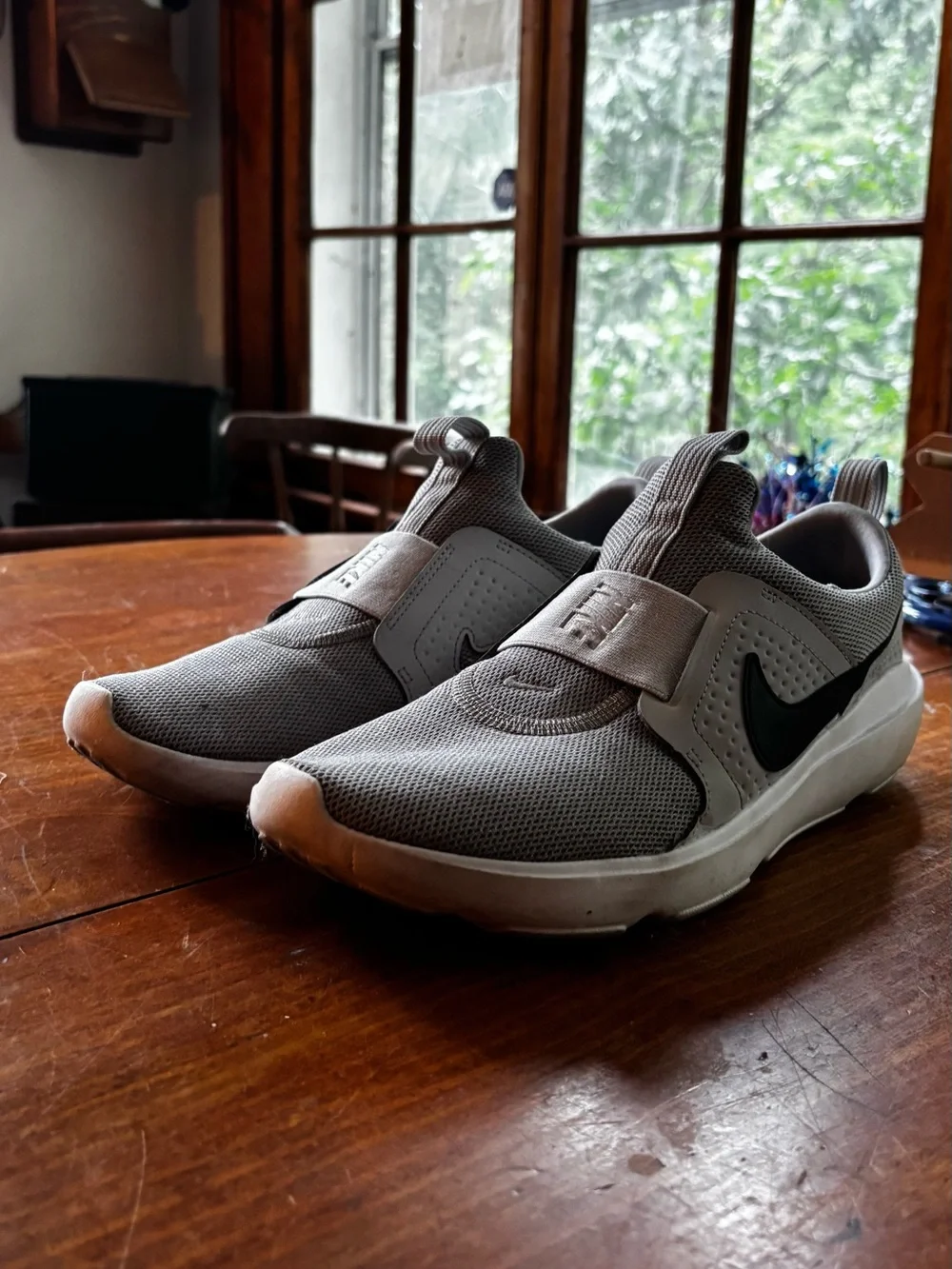 Nike Light Gray/White Slip-On Sneakers with Black Swoosh